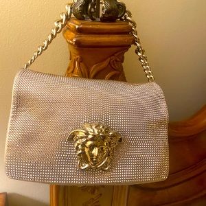 Beautiful versace bag. All crystals are intact. interior clean. 100% Authentic